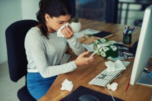 woman-in-office-sneezing