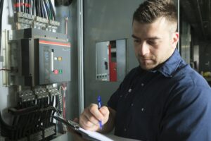 electrician-working-near-service-breaker