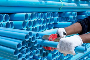 worker-cut-pvc-pipes